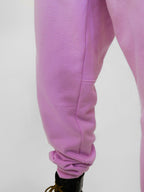 Close-up of blush sweatpants on a white background