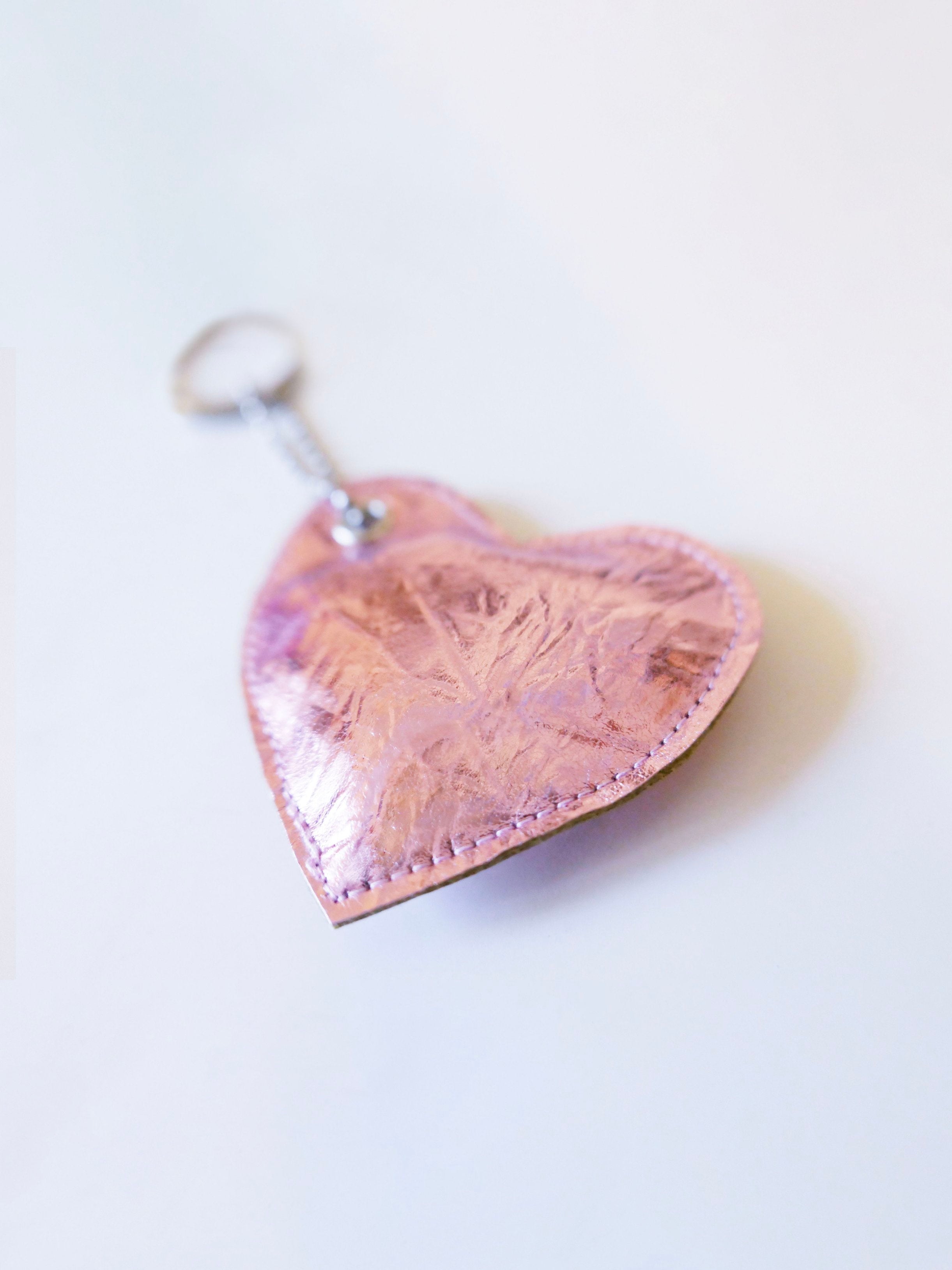 pink heart-shaped keychain on a white background