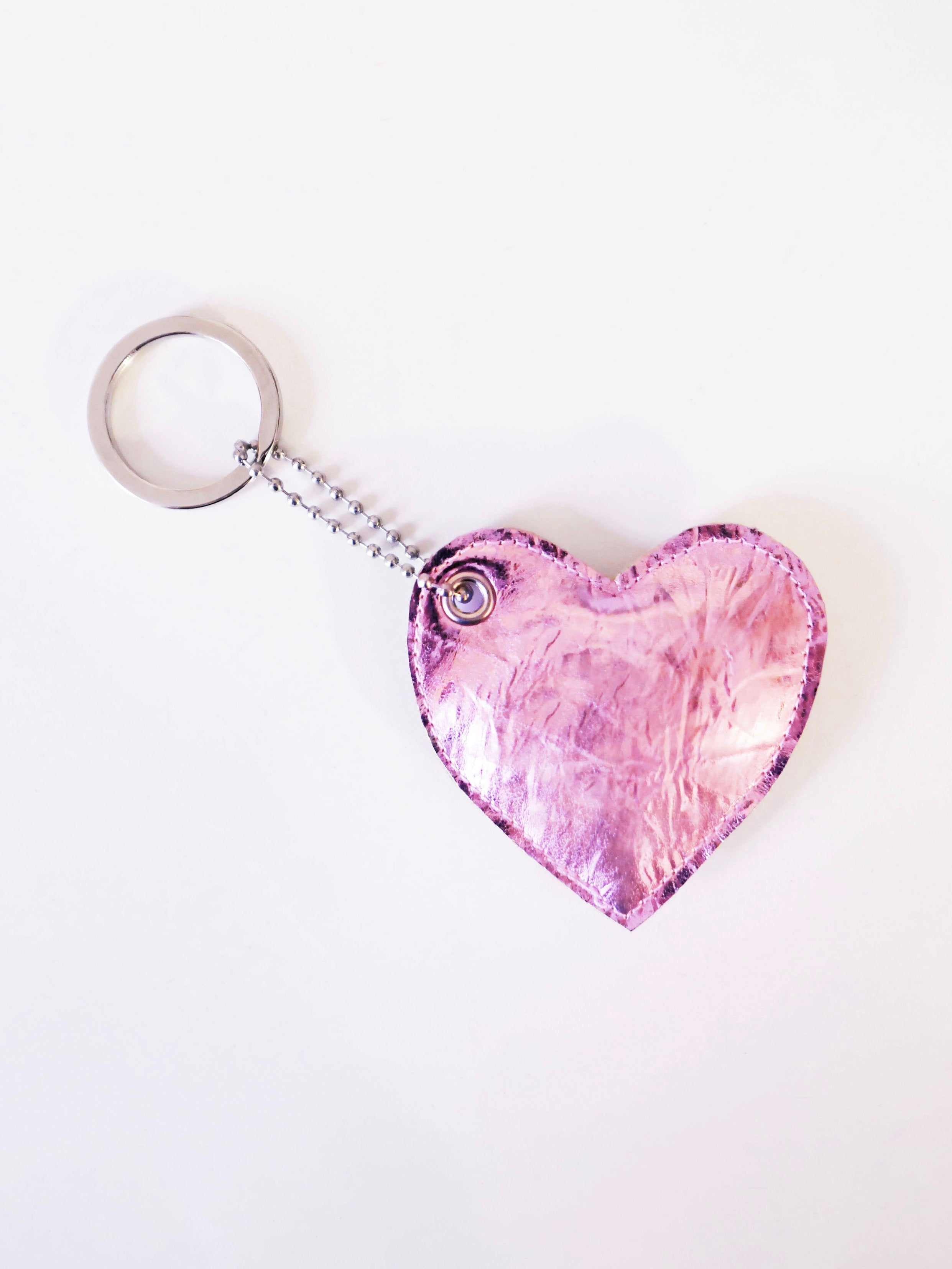 pink heart-shaped keychain on a white background