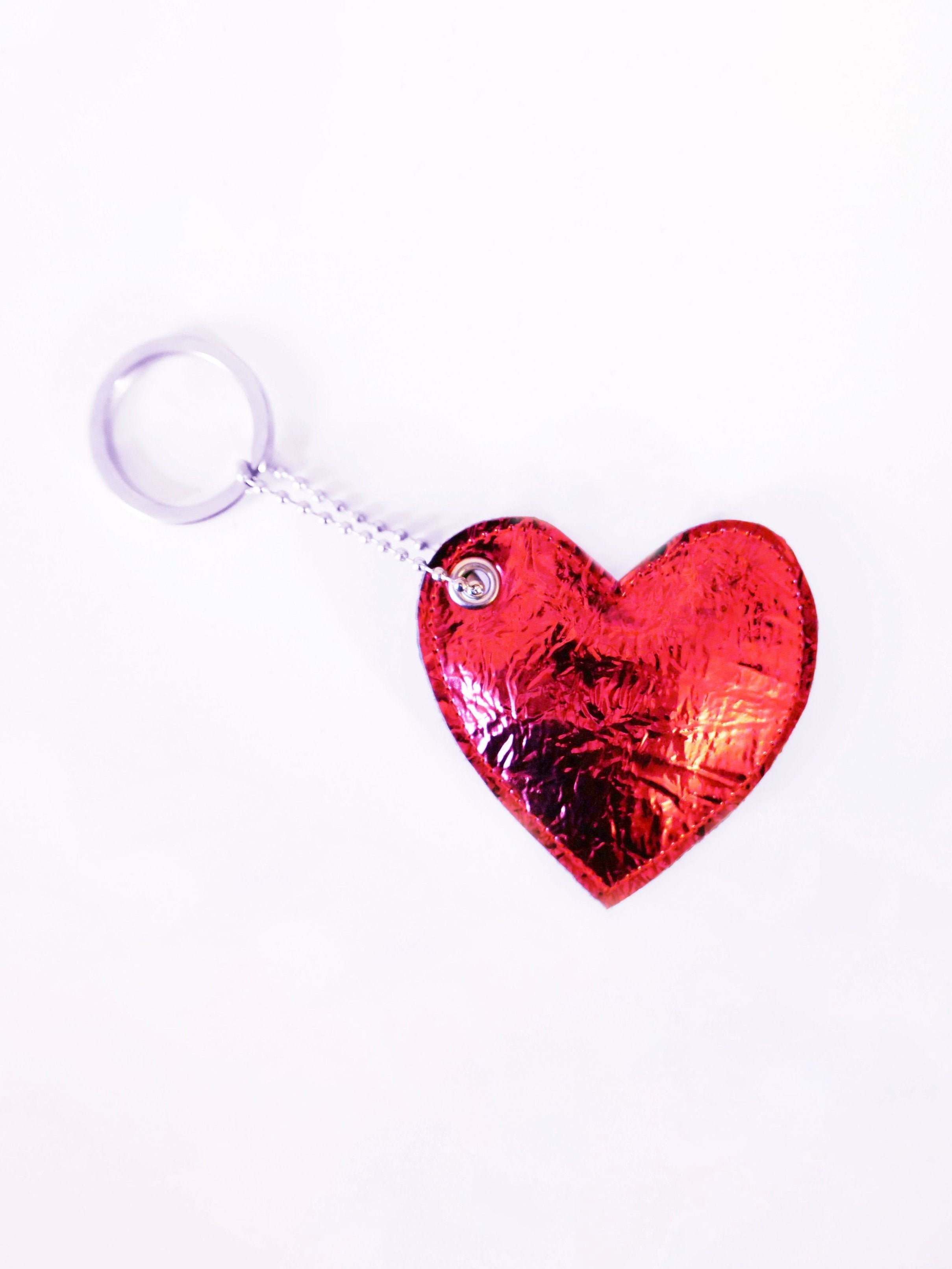red heart-shaped keychain on a white background